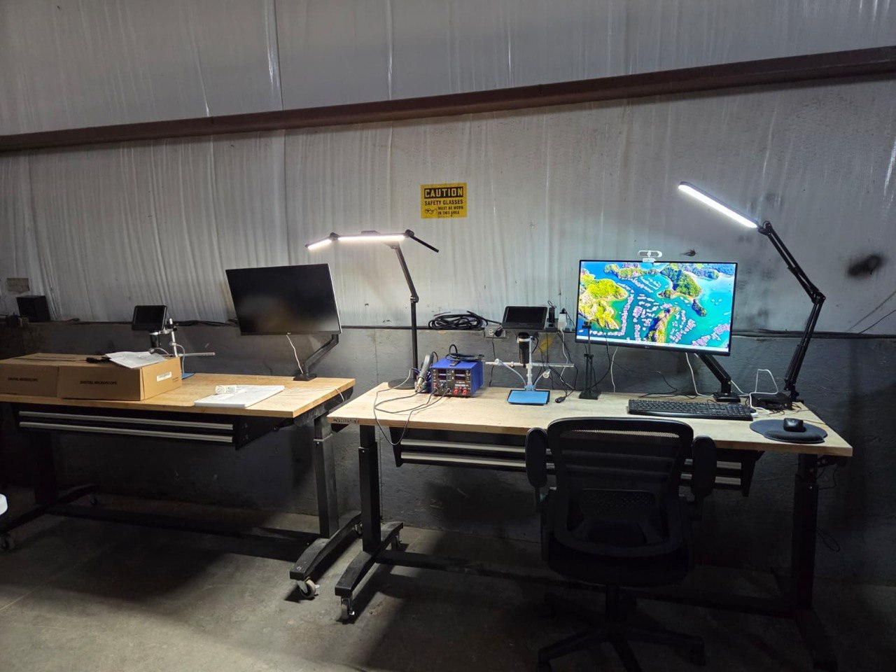 OCA repair workstations with task lighting and soldering equipment